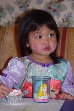 Kasen eating a pre-party cupcake